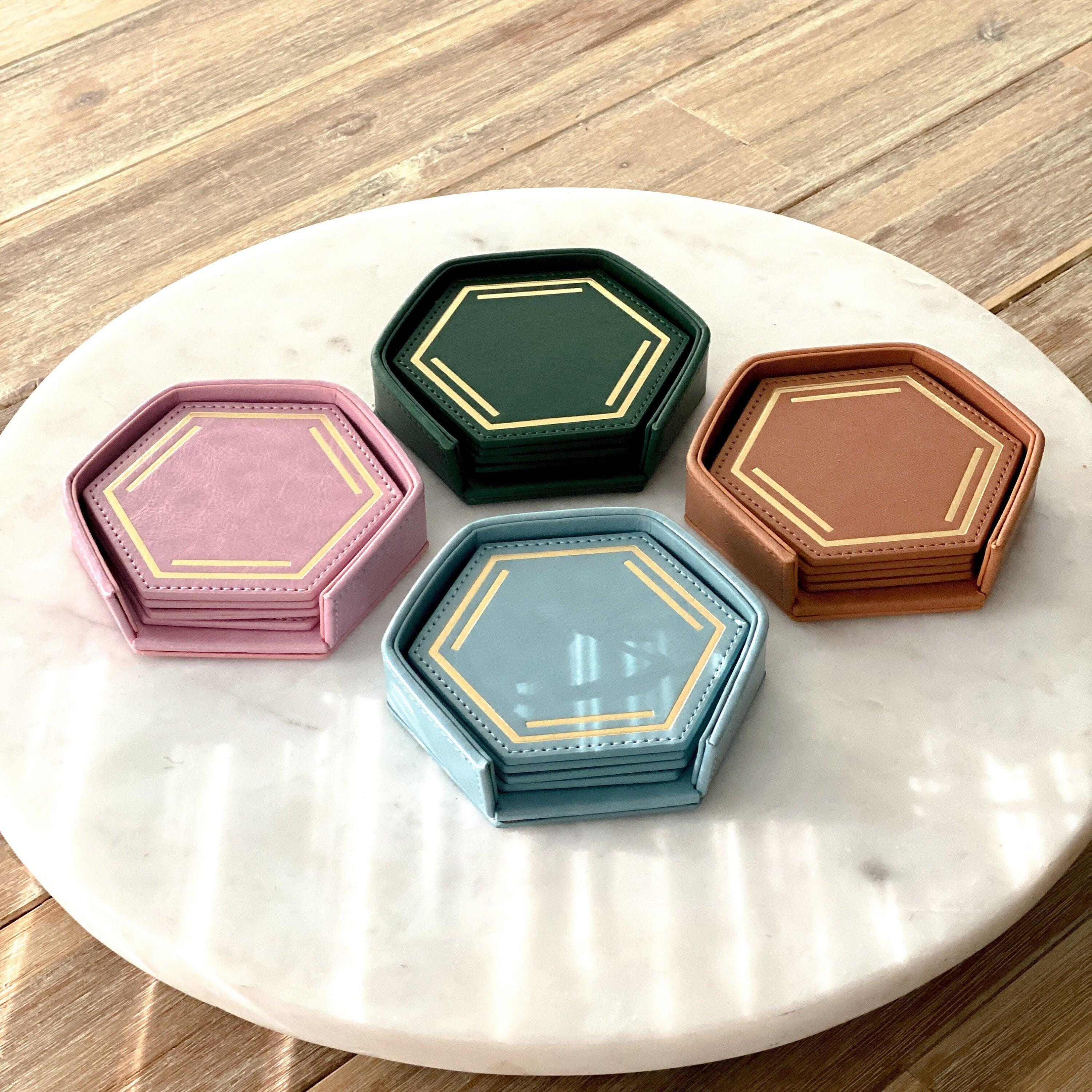 Benzene Science Chemistry Coaster Set made of PU Leather by The Calculated Chemist. Embossed with a gold foil benzene chemistry molecular structure. Perfect gift for science lovers, scientists, STEM teachers and students